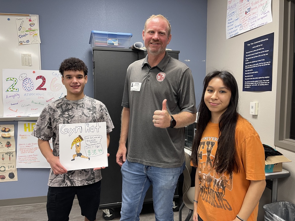 Pizzeria owner with 2 students