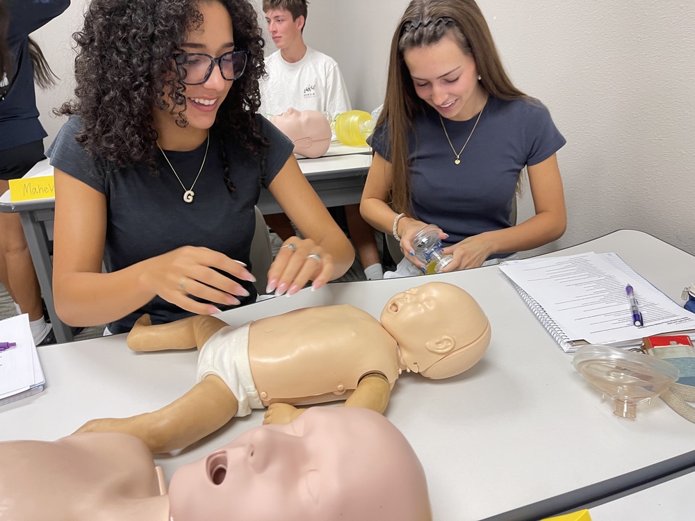 Students learning CPR