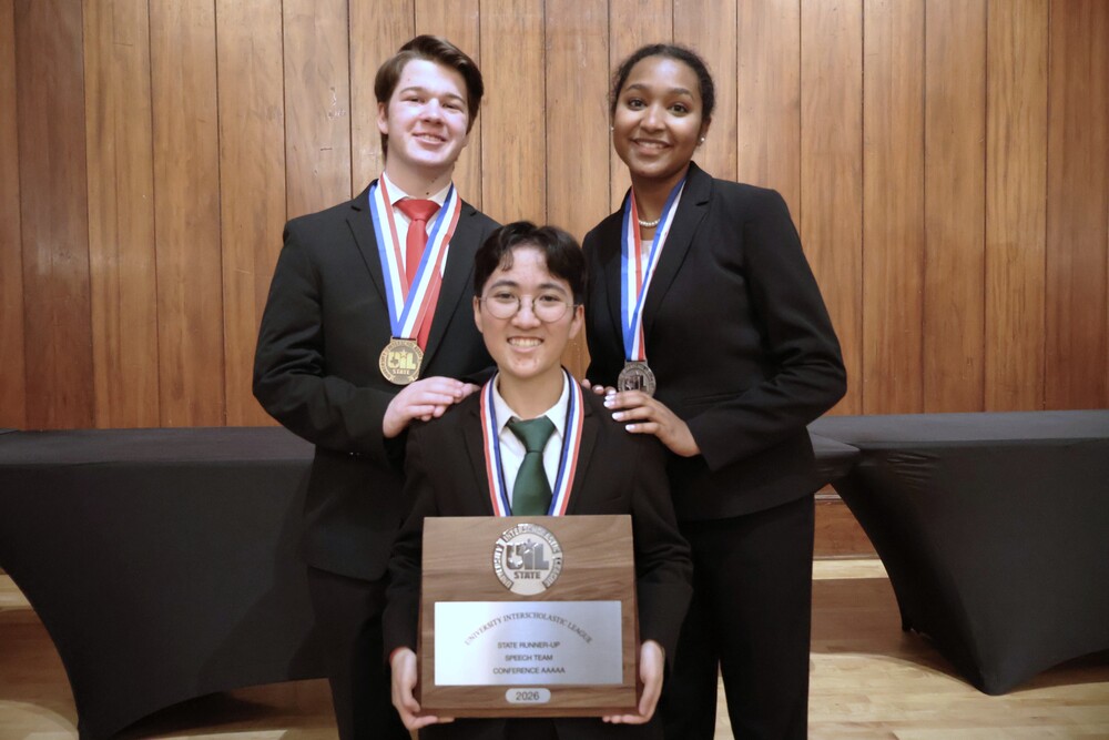Students holding UIL Academics plaque