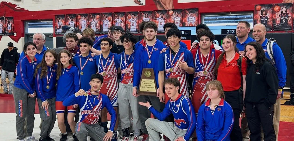 Grapevine High School Wrestling Posing with District Championship Trophy