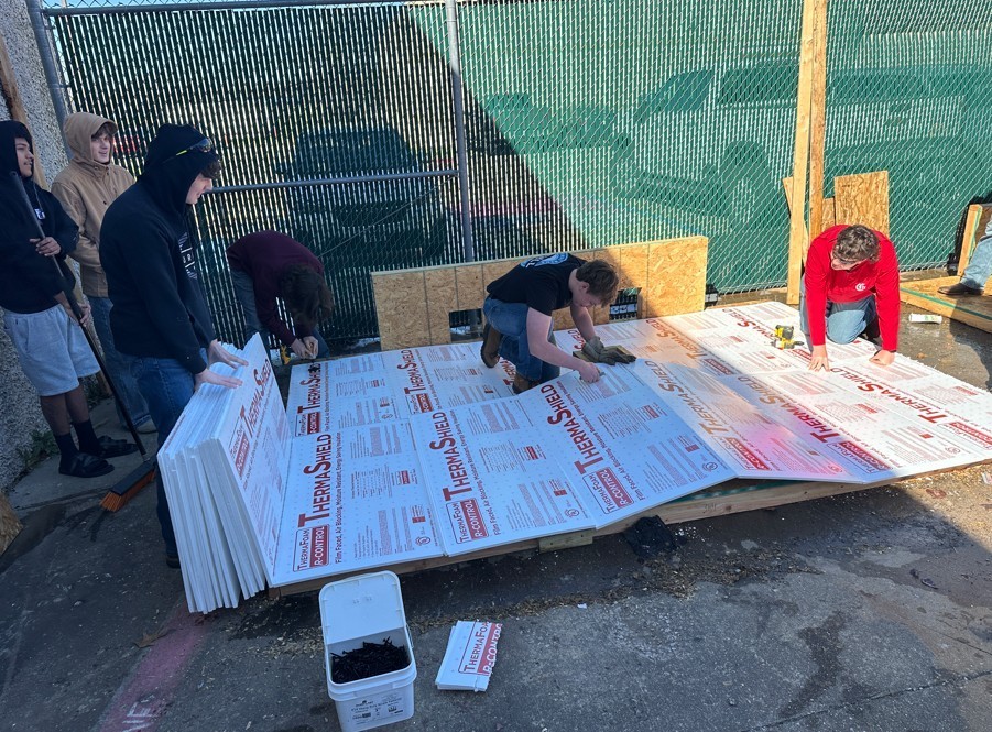 Students building roof