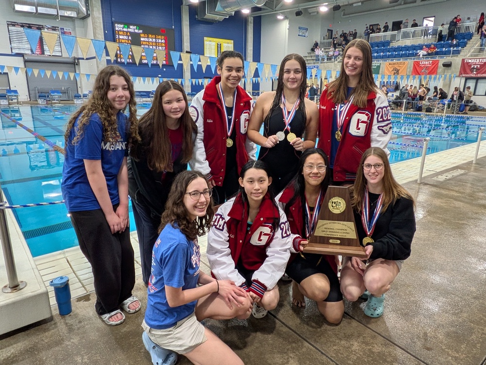 Grapevine High School Swim Team with Regional Championship Trophy