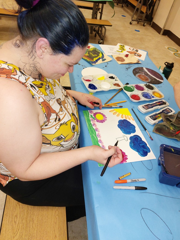 A mom paints with watercolors.