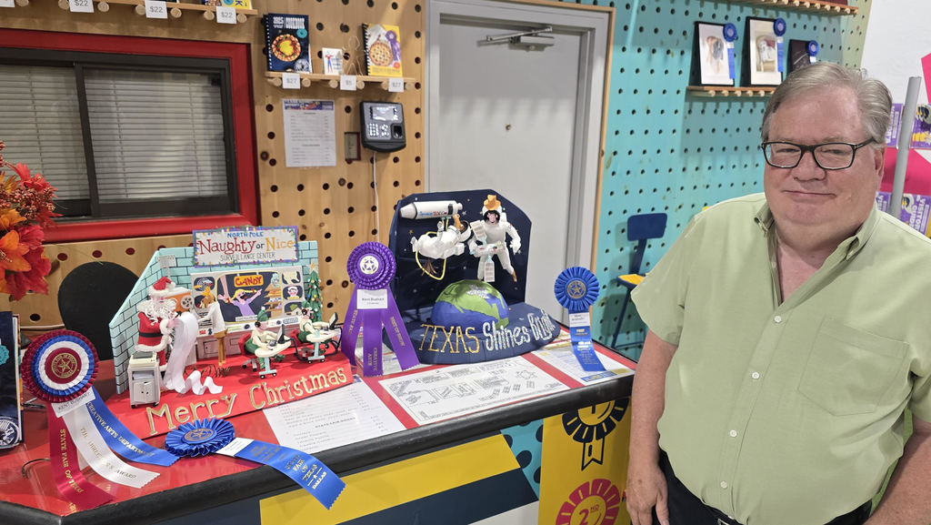 Bear Creek special education assistant with his State Fair winning projects.