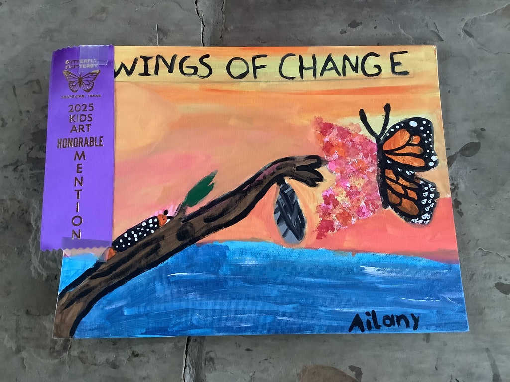Butterfly art with an honorable mention ribbon