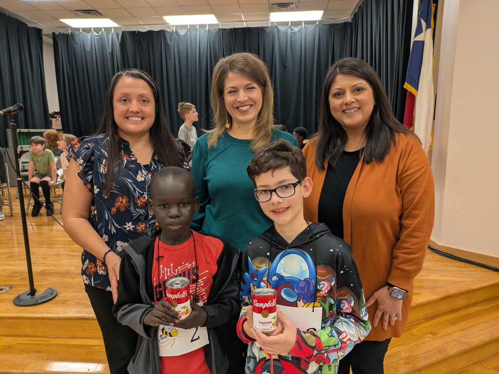 The spelling bee winner and runner up pose with the principal, assistant principal, and associate principal.