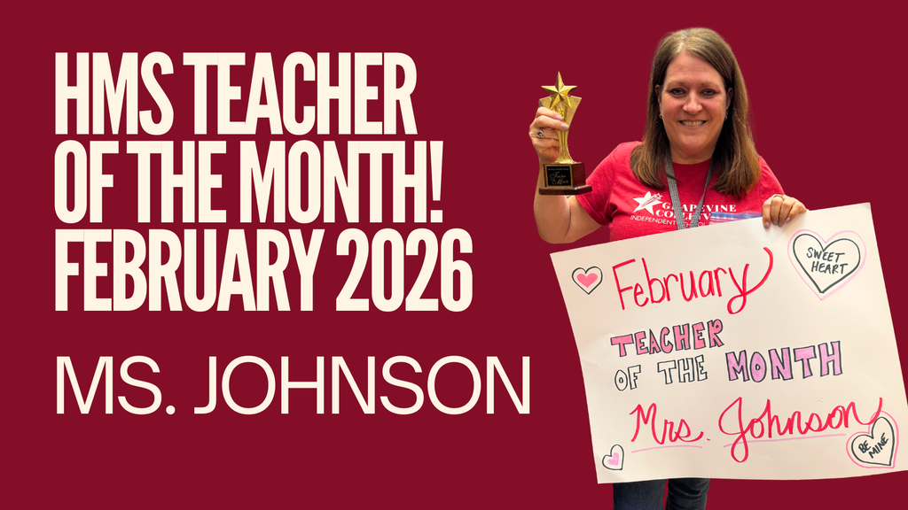 Ms. Johnson holding a Teacher of the Month poster