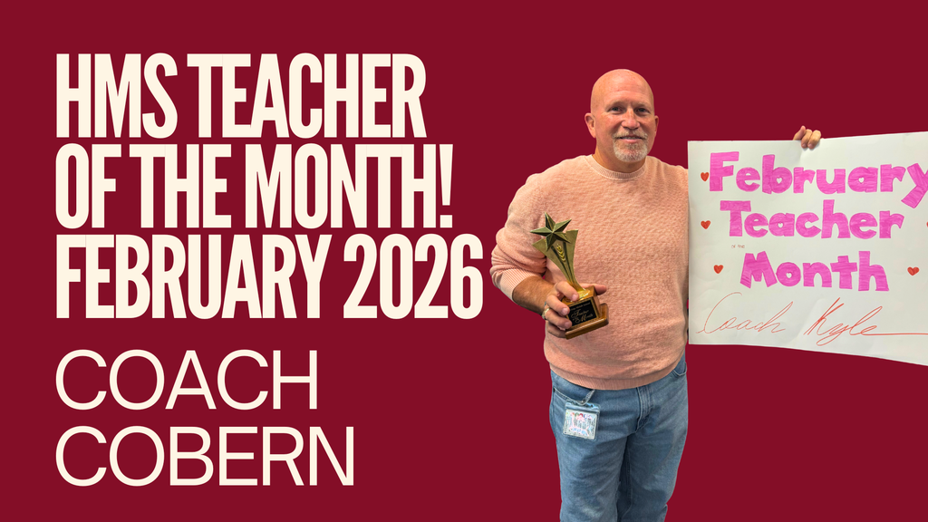 Coach Cobern holding a Teacher of the Month poster