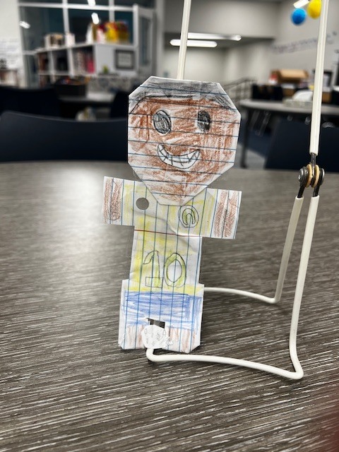 paper doll made to look like the soccer player Pele