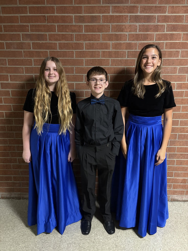 Choir students smiling after competition