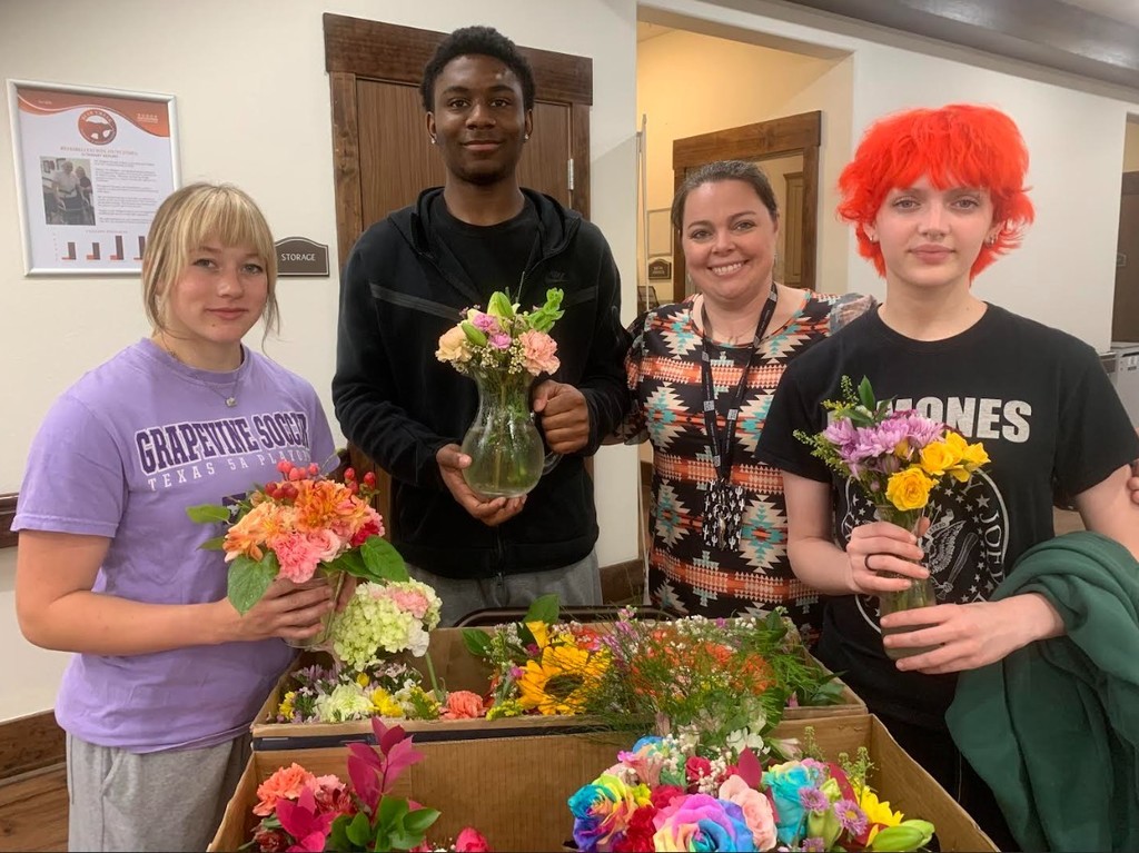 CTE floral design students making deliveries to senior citizens home
