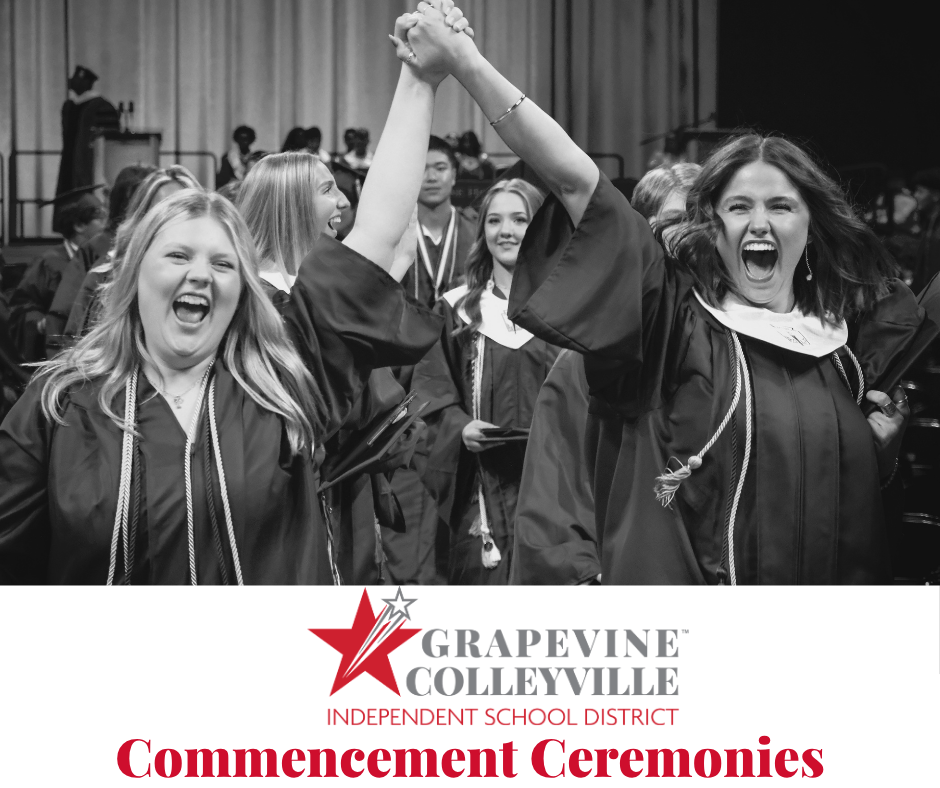 Two graduates holding hands
