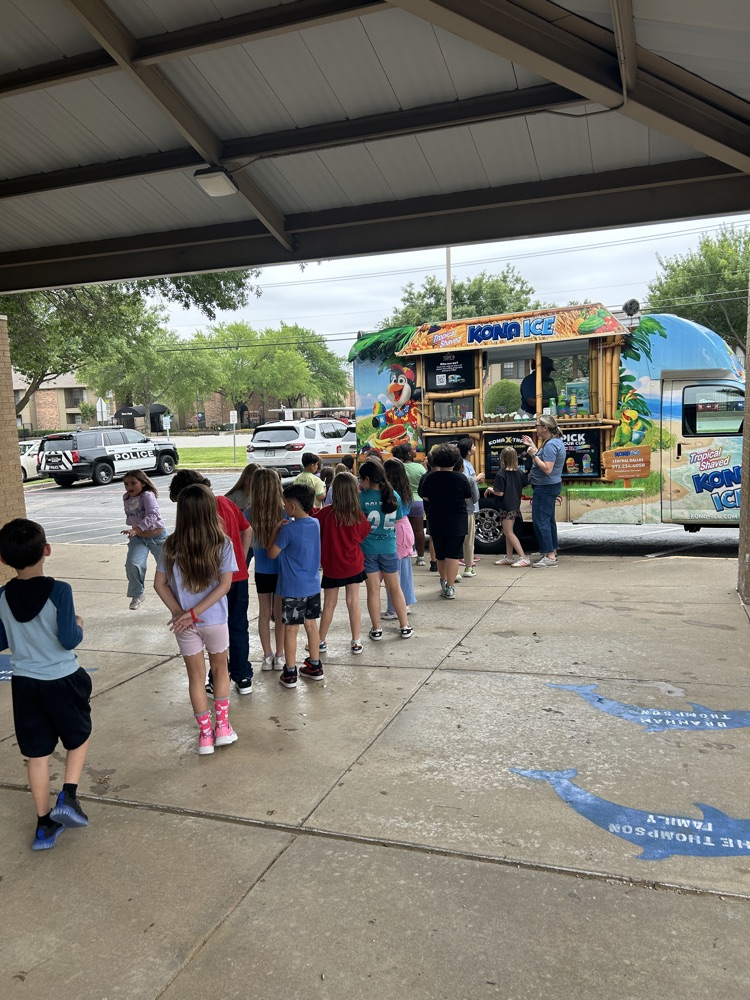 students waiting in line at snow cone truck