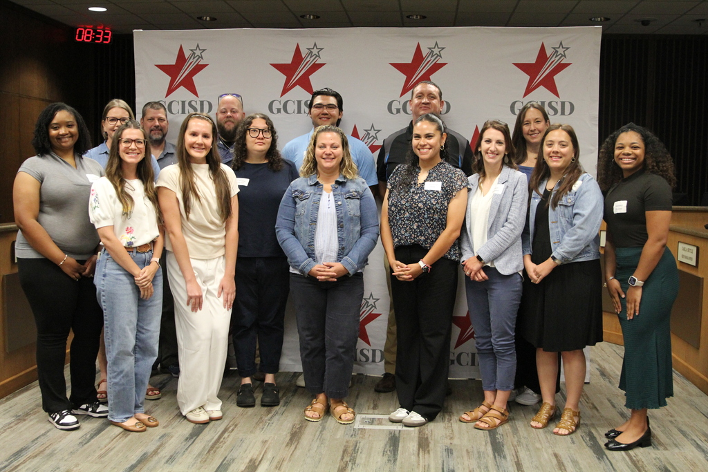 New hires pose at second new hire orientation of the school year. 