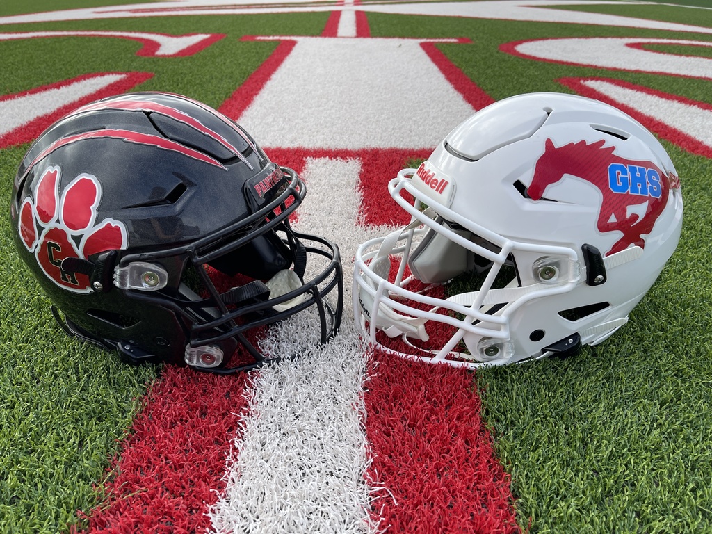 CHHS and GHS football helmets on field