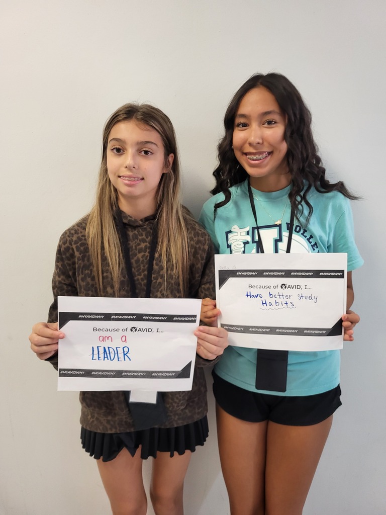 Students show their answers to the question "Because of AVID I..."
