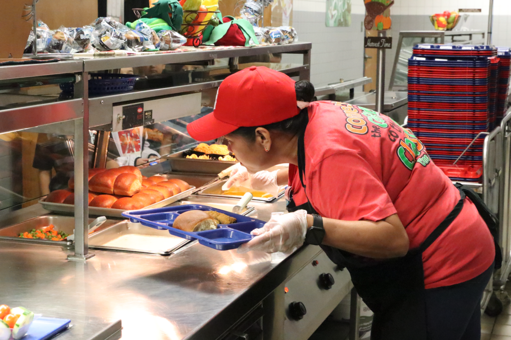 GCISD nutrition worker serving lunch in the lunch line