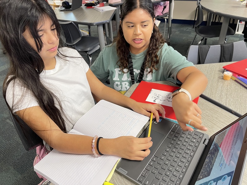 Teacher with student