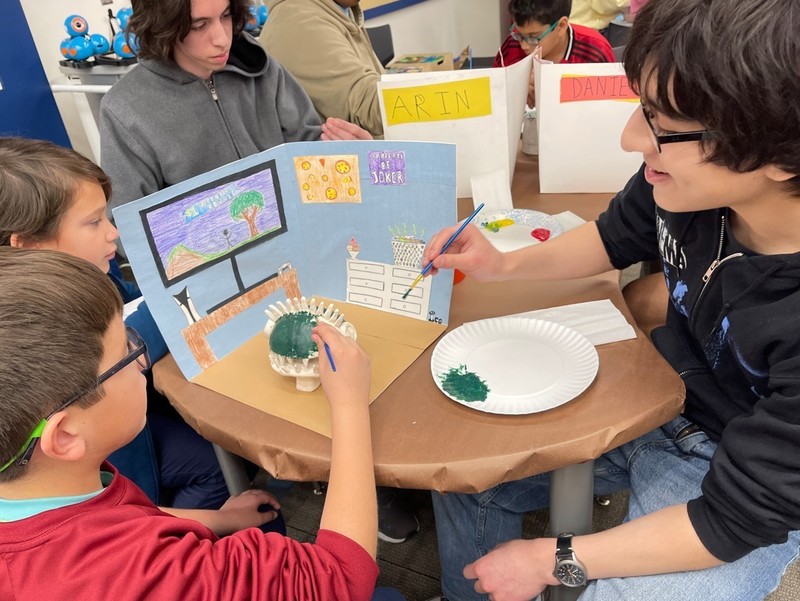 Students painting together