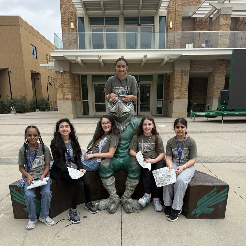 6th grade group at UNT in front of an eagle statue