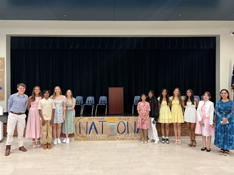 8th grade NJHS leadership posing for a picture in the cafeteria