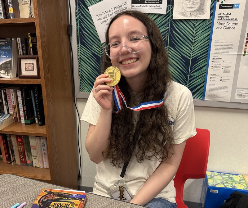 GHS student holding medal