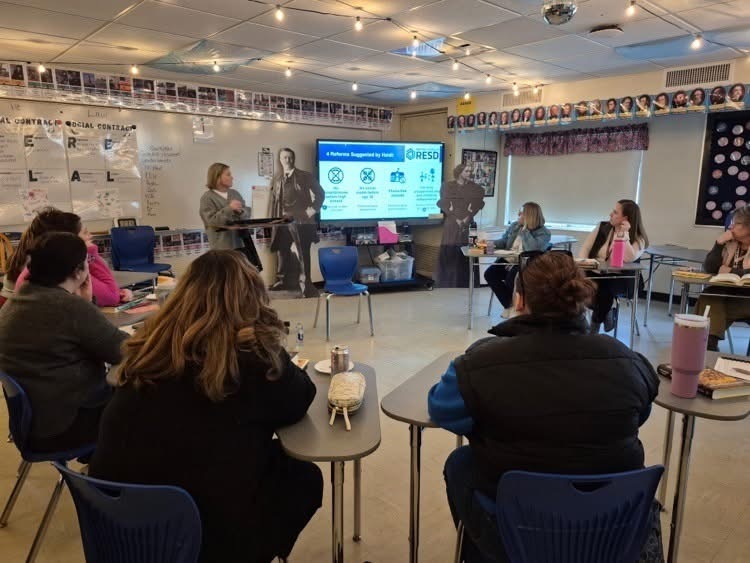 Secondary teachers participating in a book study discussion. 