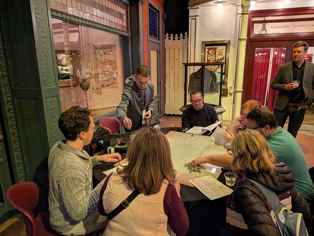 Educators play Dungeons and Dragons at the MACUL after-hours reception.