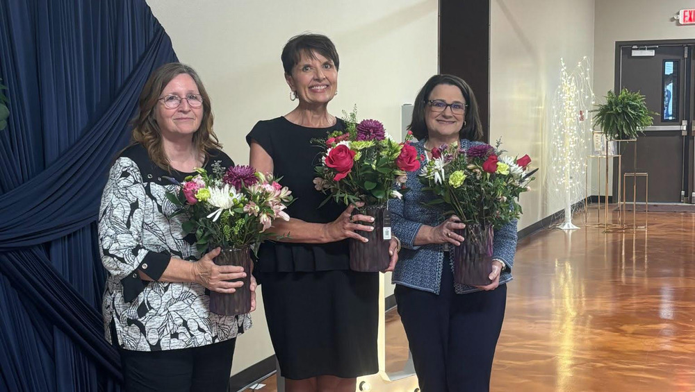 Sheila Roughton, Heather Finley and Lisa Singleton were presented with flowers for their 10 years of service to Bright Futures.
