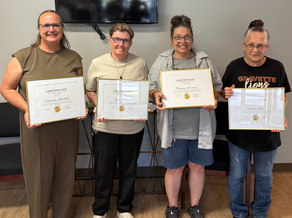 Classified Staff of the Year Carissa Lewallen, an Alternative Education Paraprofessional at Gravette Upper Elementary, Tammy Forcum, a custodian at Glenn Duffy Elementary, Janice Dye, a cook at Gravette Middle School and Kay Robbins, a district bus driver