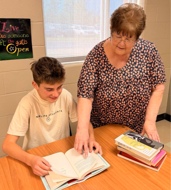 Mrs. Tolle working with a student in class