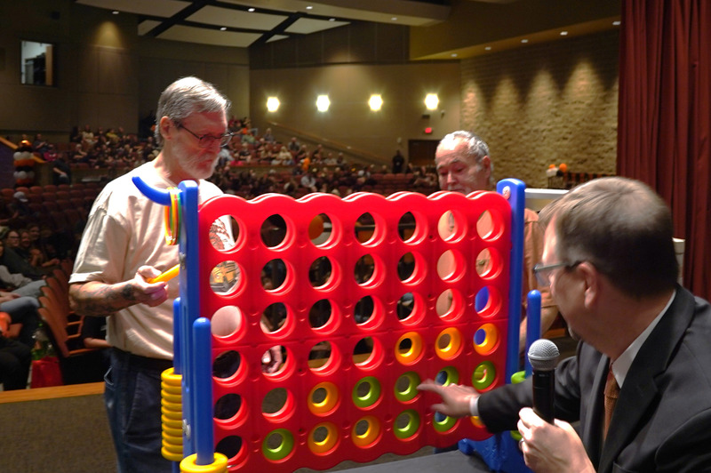 Richard Carver and Mike Walker compete in a game of giant Connect Four