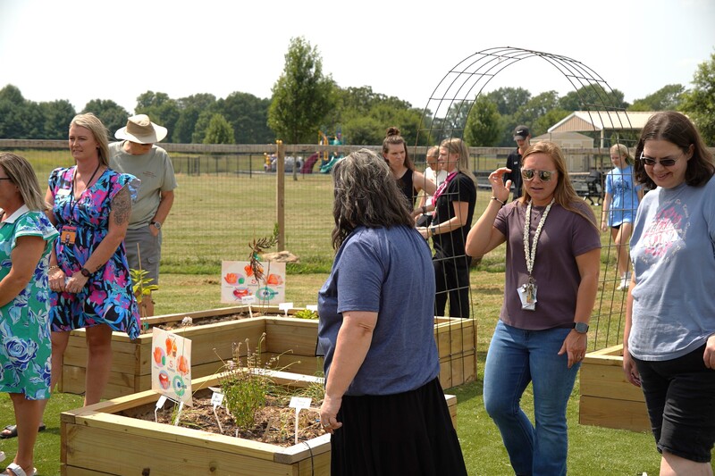 Staff and families of Gravette Schools explore the Outdoor Classroom at the Grand Opening Ceremony