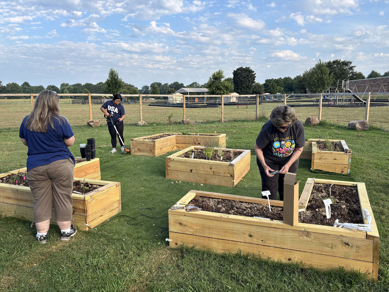 Gravette Schools staff working on the garden beds over the summer