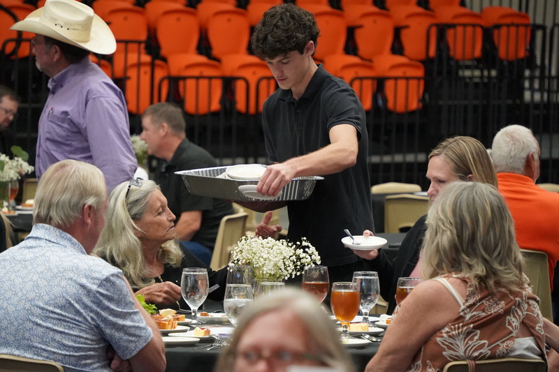 Student Serving at Hall of Honor Banquette