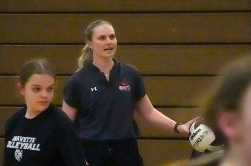 Coach Duke working with the Middle School Volleyball Team