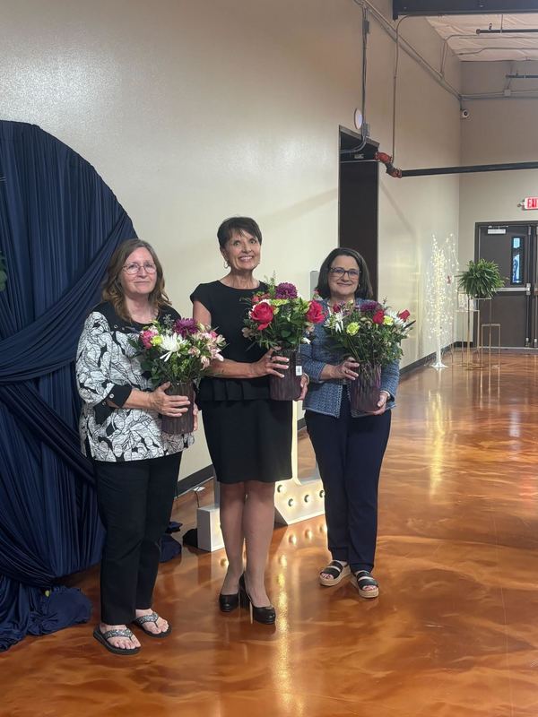 Sheila Roughton, Heather Finley and Lisa Singleton were presented with flowers for their 10 years of service to Bright Futures.