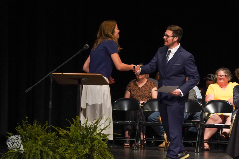 Alexis Lawrence, representing John Brown University, presented a scholarship award to a Gravette High School senior during the scholarship ceremony.