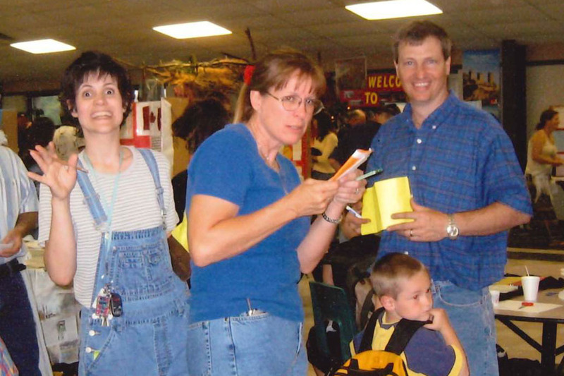Shirley Reynolds, school nurse Marie Kane, Randall Reynolds, and Thomas Reynolds at the GMS Country Day festival where students set up booths and presented projects they had worked on all year long in Robin Morris’s social studies class (2003)