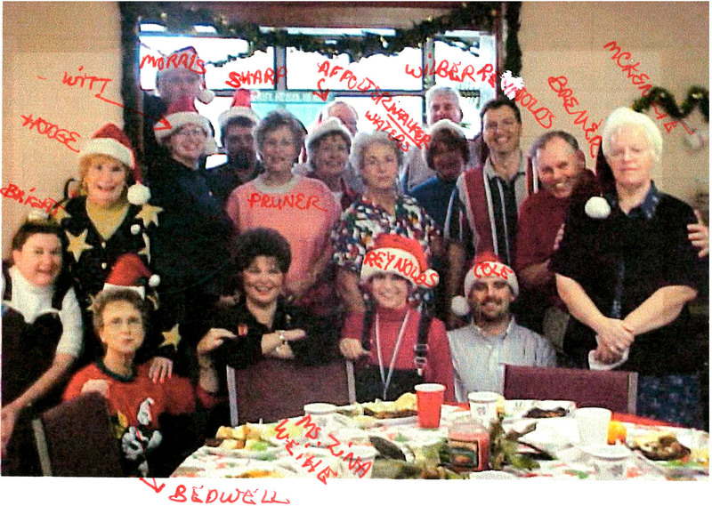 A staff Christmas photo taken shortly after the Reynolds began working at Gravette Middle School
