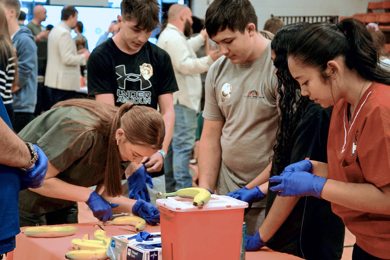 Students practiced hands-on medical skills while learning about patient care and career opportunities in the healthcare field.