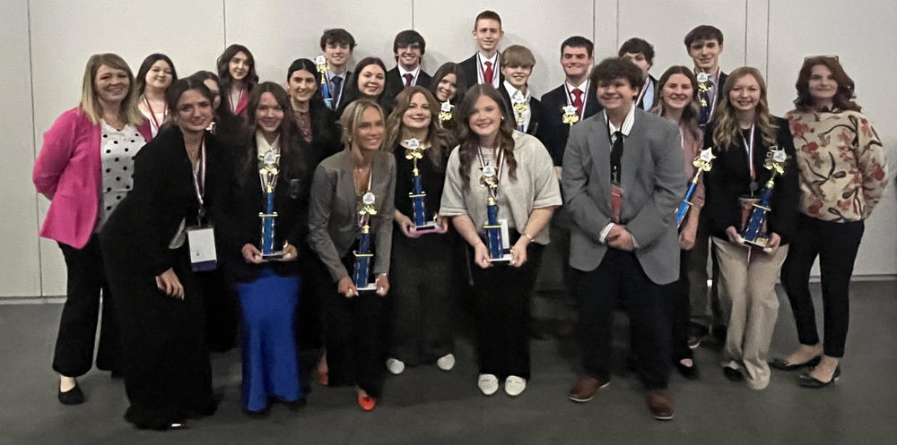 GCHS DECA participants at State conference with trophies