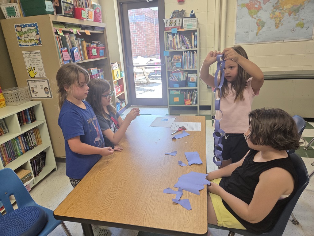 3rd grade builds the longest paper chain in 15 minutes!