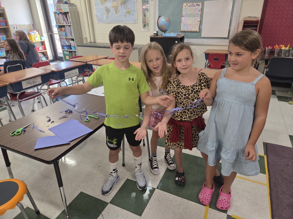 3rd grade builds the longest paper chain in 15 minutes!