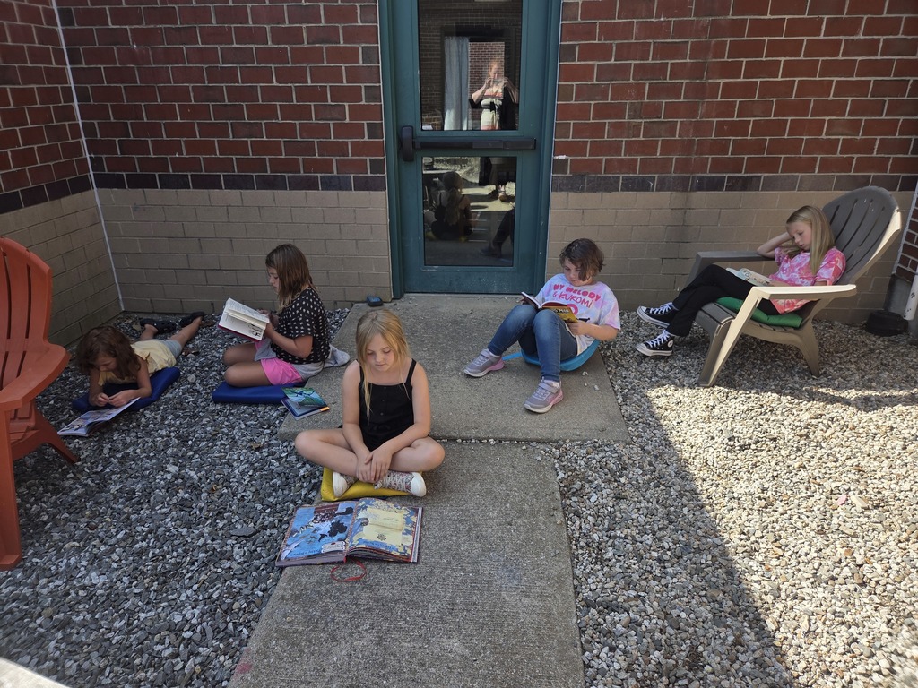 It has been beautiful weather for courtyard reading time in third grade!