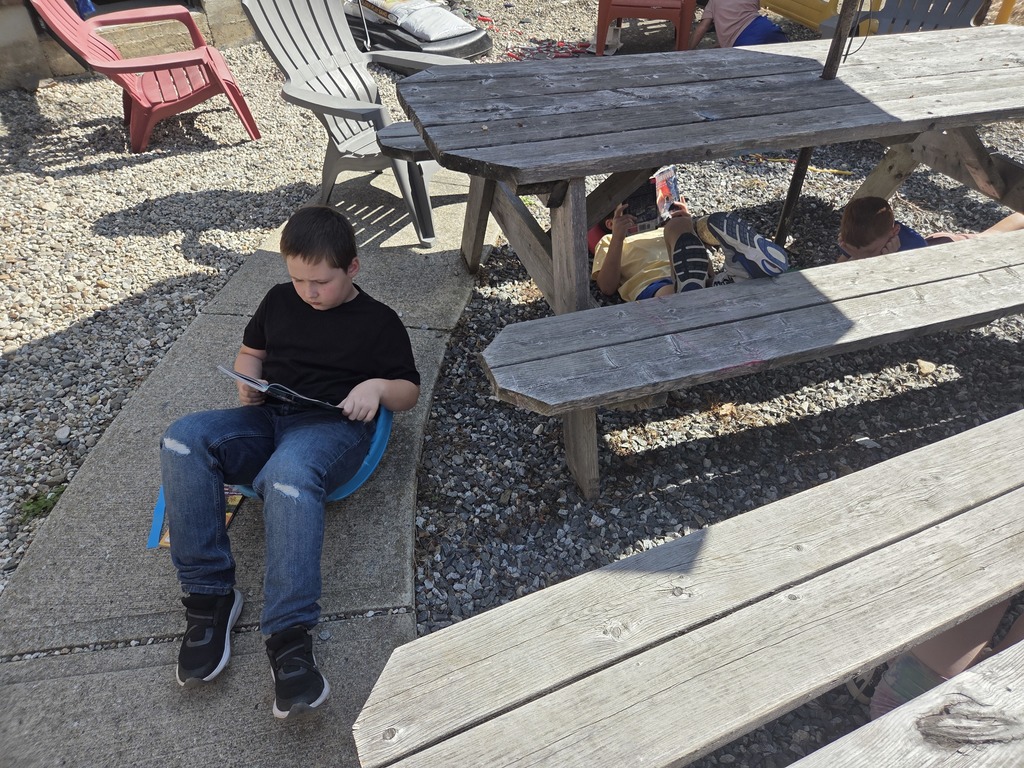 It has been beautiful weather for courtyard reading time in third grade!