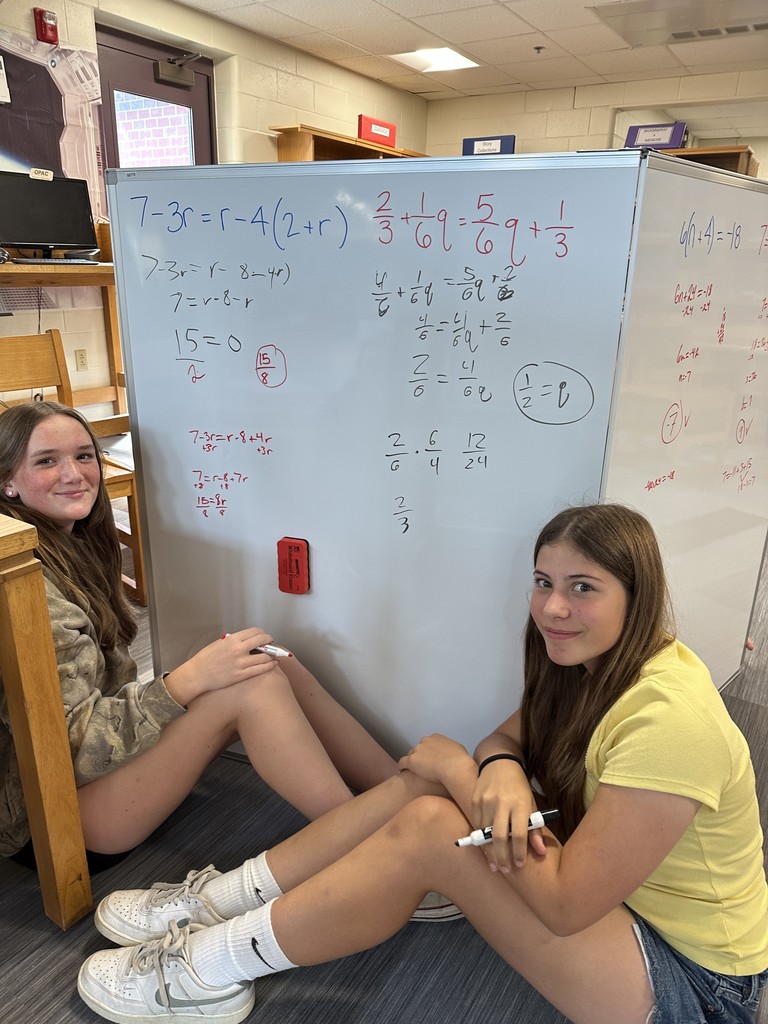 8th grade Algebra students use giant whiteboards to solve their equations! 