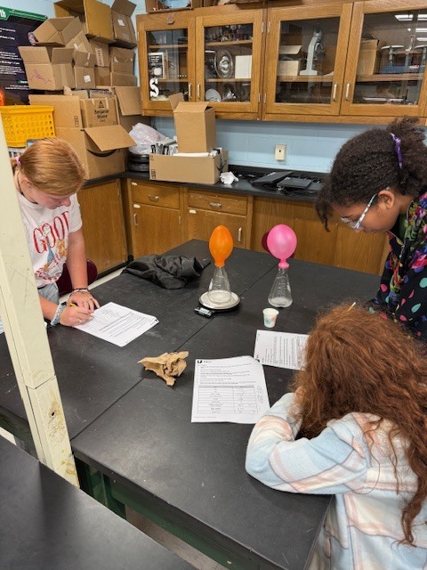 8th grade learns about the Law of Conservation of Mass using open and closed systems