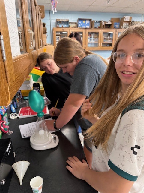 8th grade learns about the Law of Conservation of Mass using open and closed systems