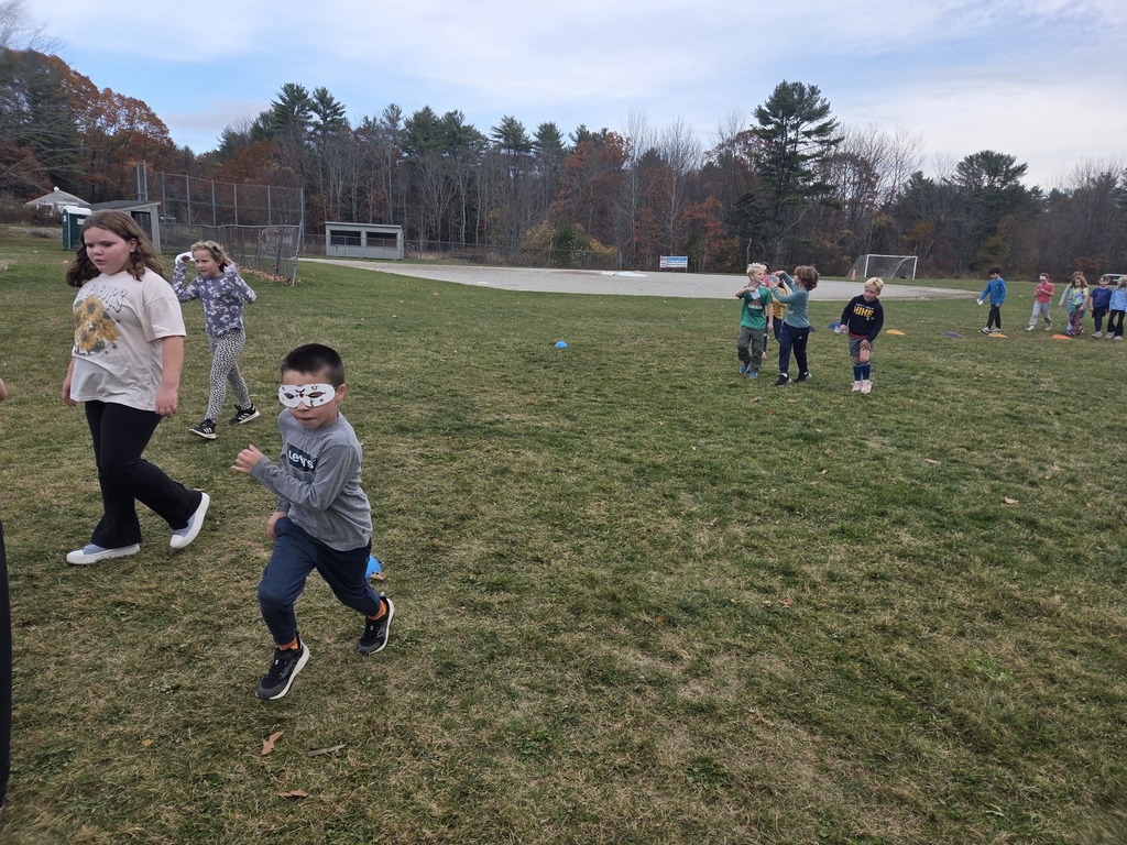 Third graders enjoyed making masks for the jog-a-thon then running wild through the obstacle course.